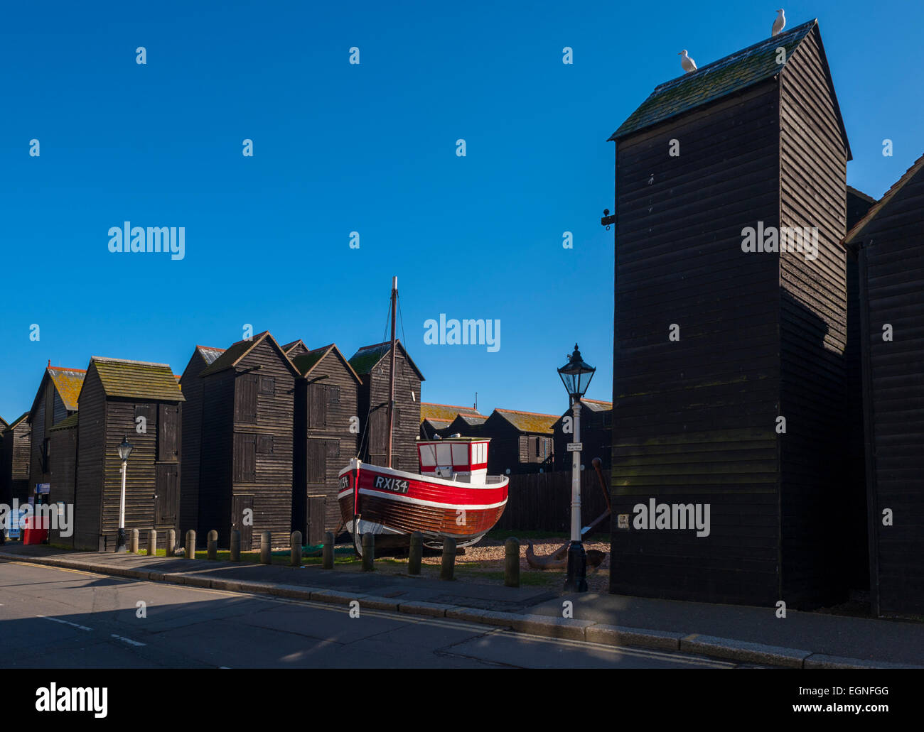 The net sheds on the Stade in Hastings with a fishing boat in the museum Stock Photo