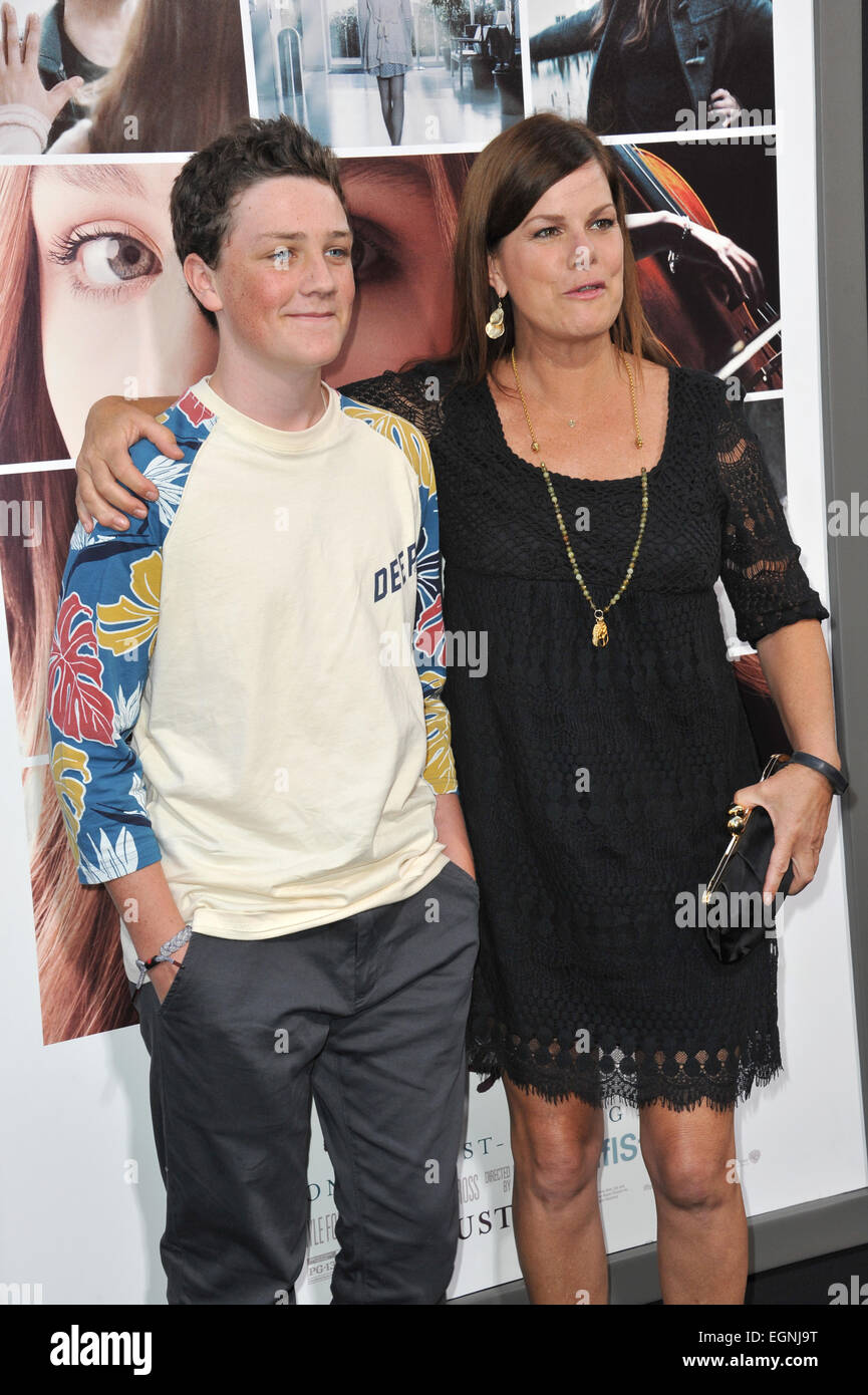 LOS ANGELES, CA - AUGUST 20, 2014: Marcia Gay Harden & son at the world premiere of "If I Stay" at the TCL Chinese Theatre, Hollywood. Stock Photo