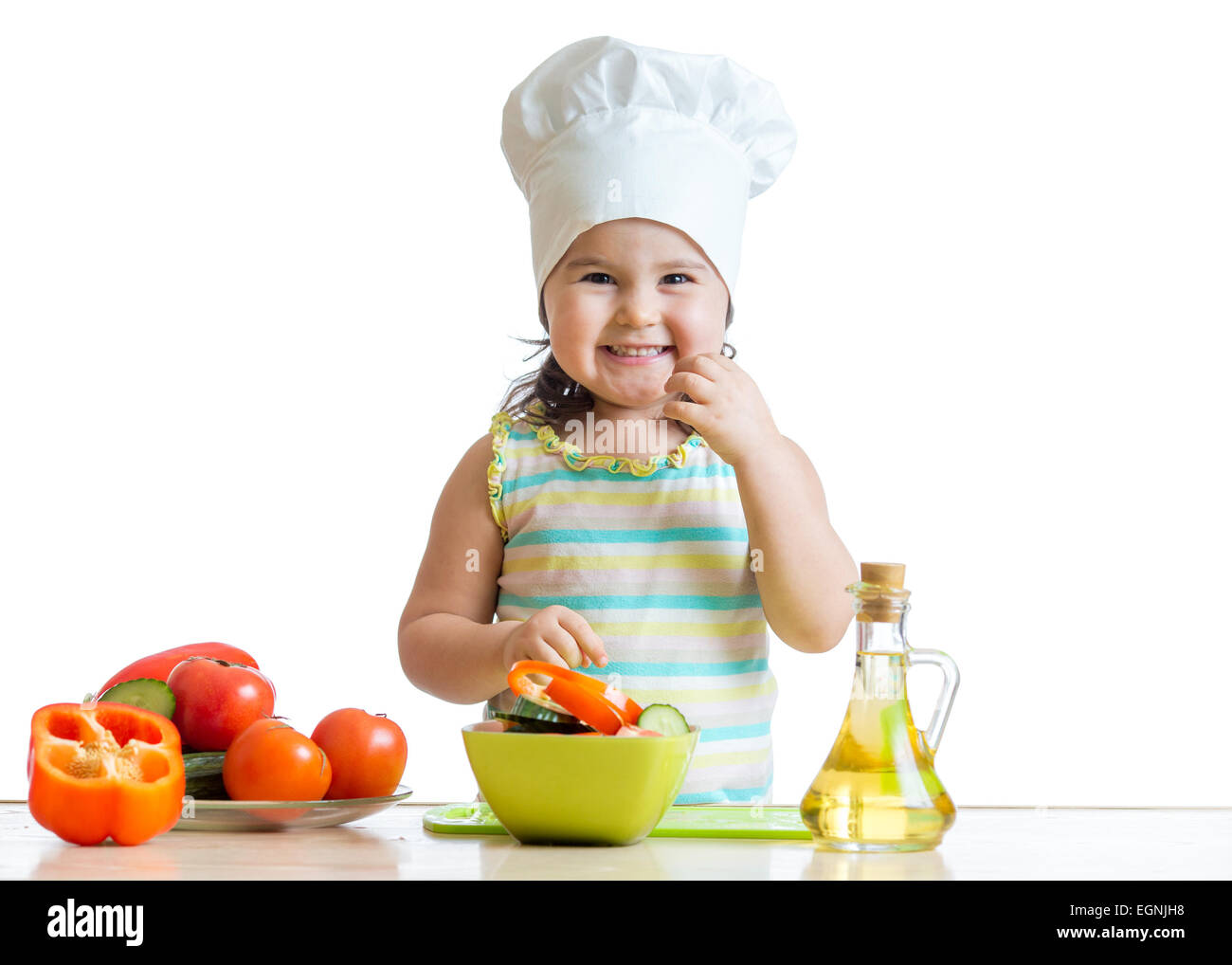 child preparing healthy food in the kitchen Stock Photo