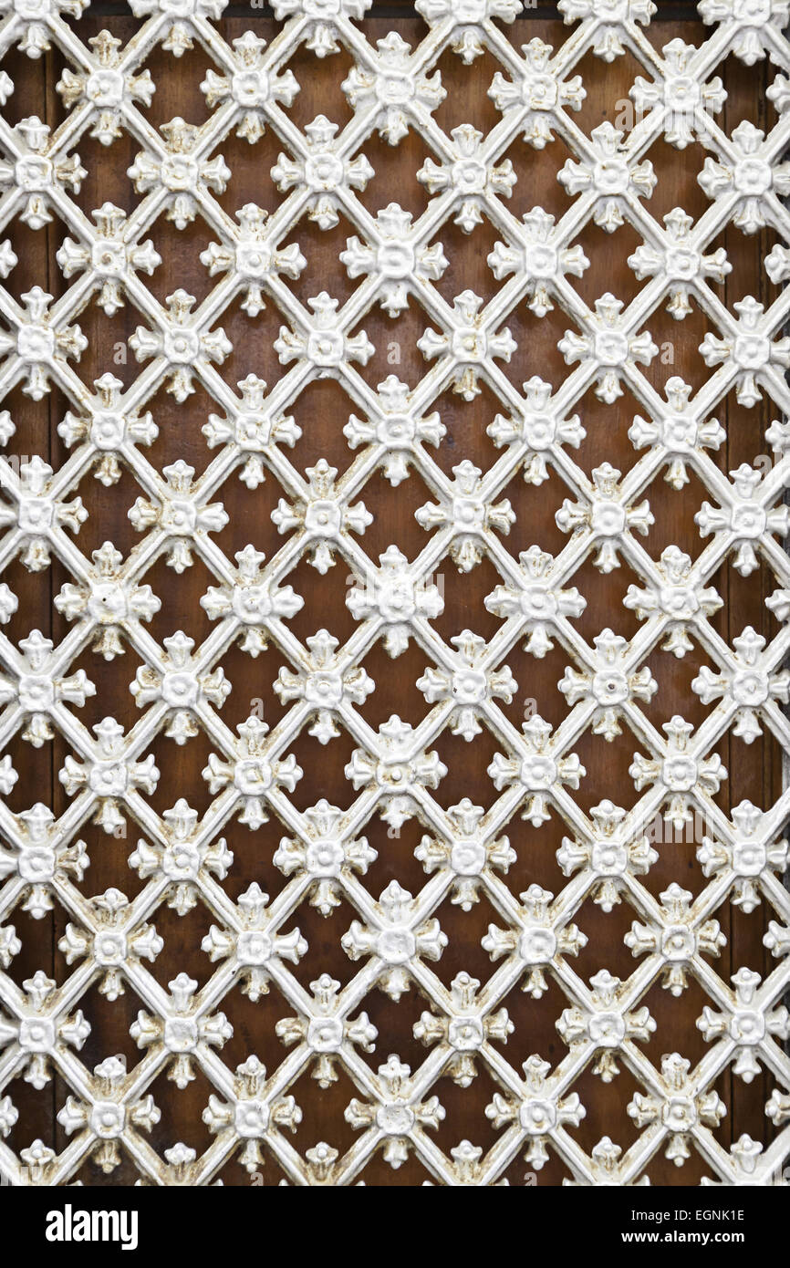 White metal fence, detail of a grille protection with decoration, security Stock Photo