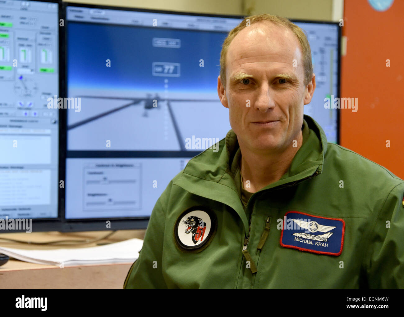 Jagel, Germany. 17th Feb, 2015. Commander Michael Krah stand in front of a set of computer monitors during a training session for fighter pilots how to steer and fly a drone in Jagel, Germany, 17 February 2015. It is for the first time that soldiers in germany are being trained how to fly an unmanned drone. Theoretical training takes place in front of a simulatoir in Kropp. Practical training continues at a llater stage in Israel. Photo: Carsten Rehder/dpa/Alamy Live News Stock Photo