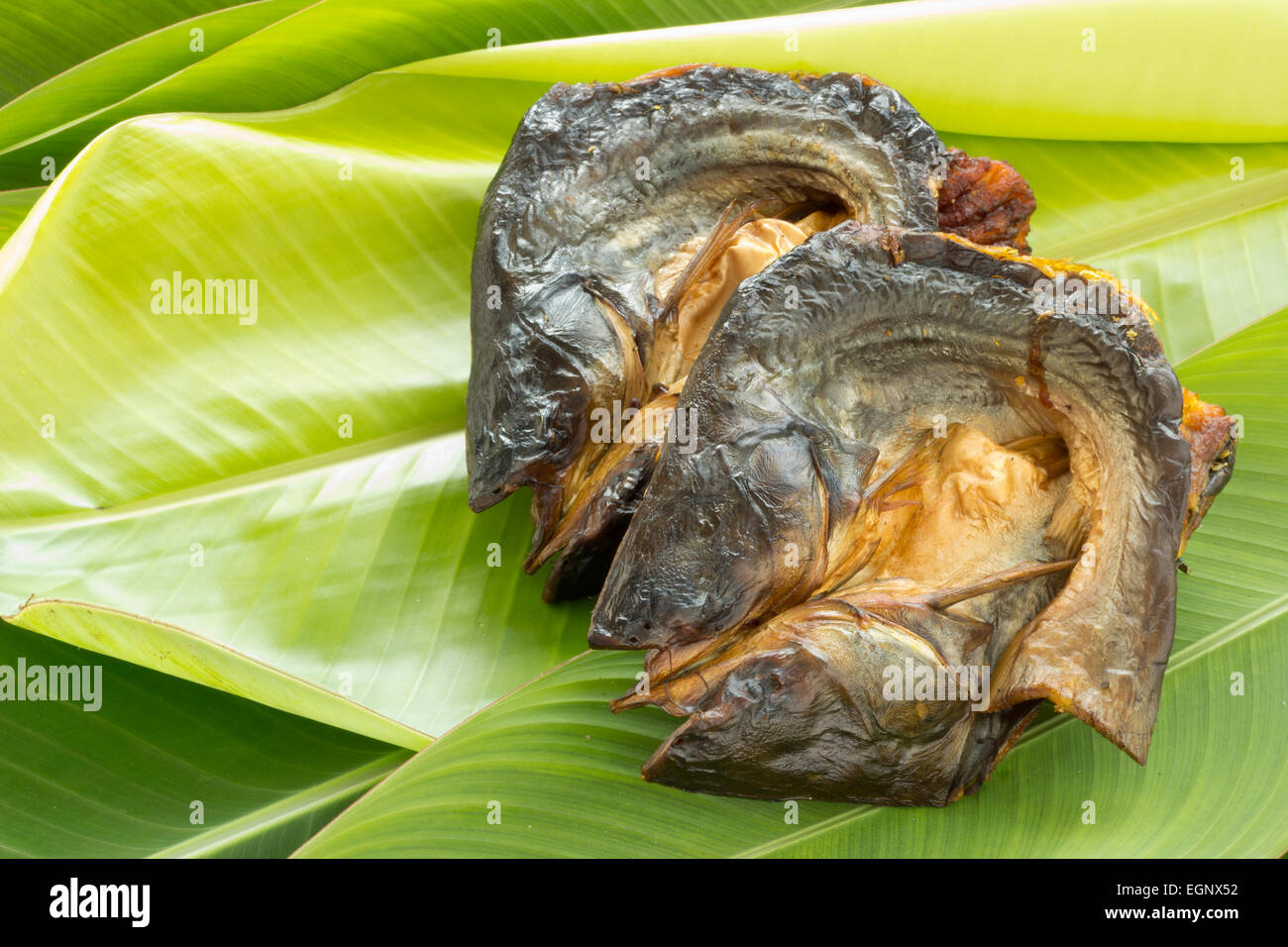 Fish on banana leaf hi-res stock photography and images - Alamy