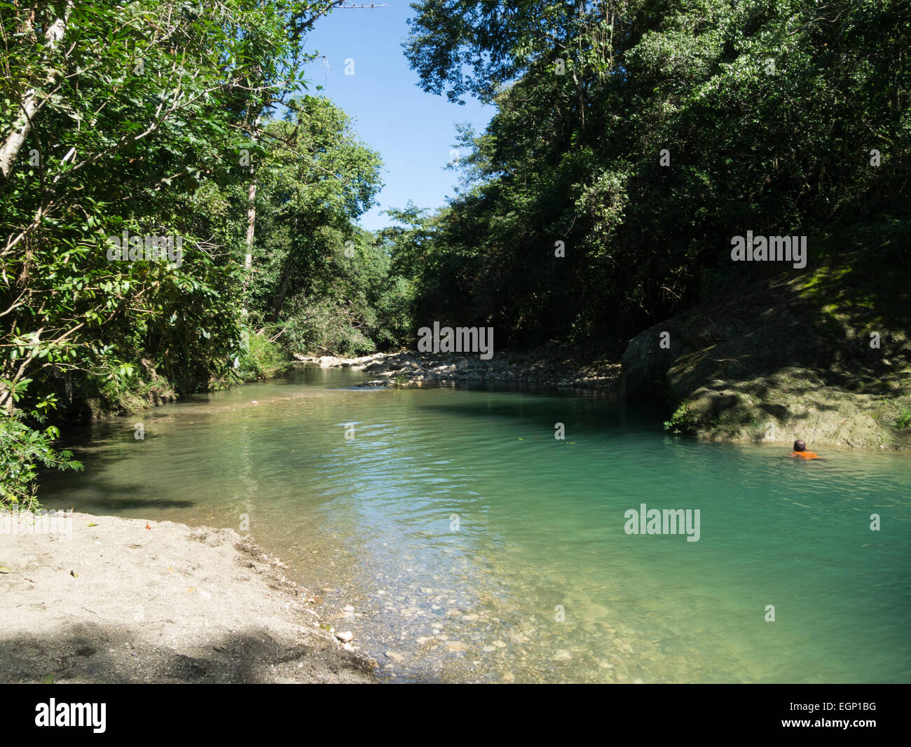 Male tourist swimming in Rio Bajabonico clean river Puerto Plata ...