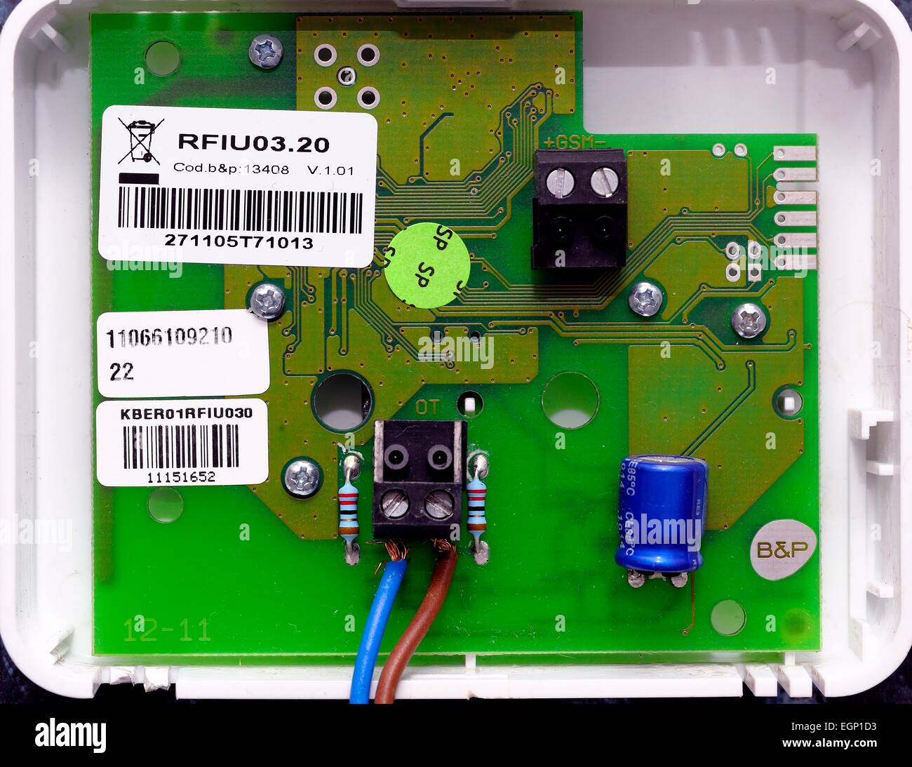 A small circuit board on the back of a heating control module Stock