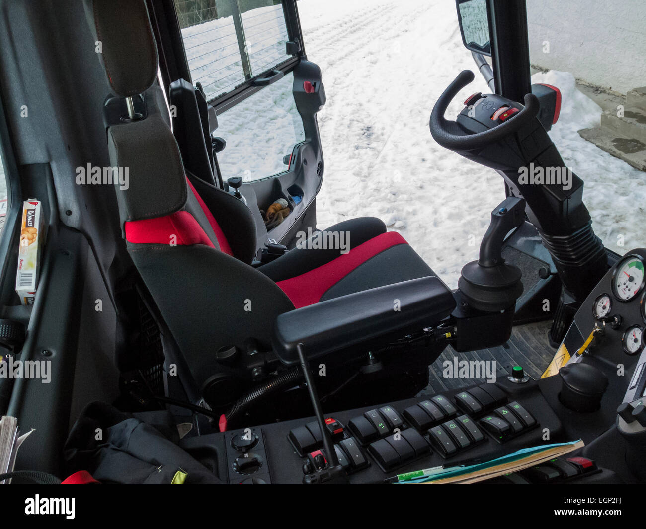 Inside a PistenBully piste groomer. The driver's seat Stock Photo Alamy