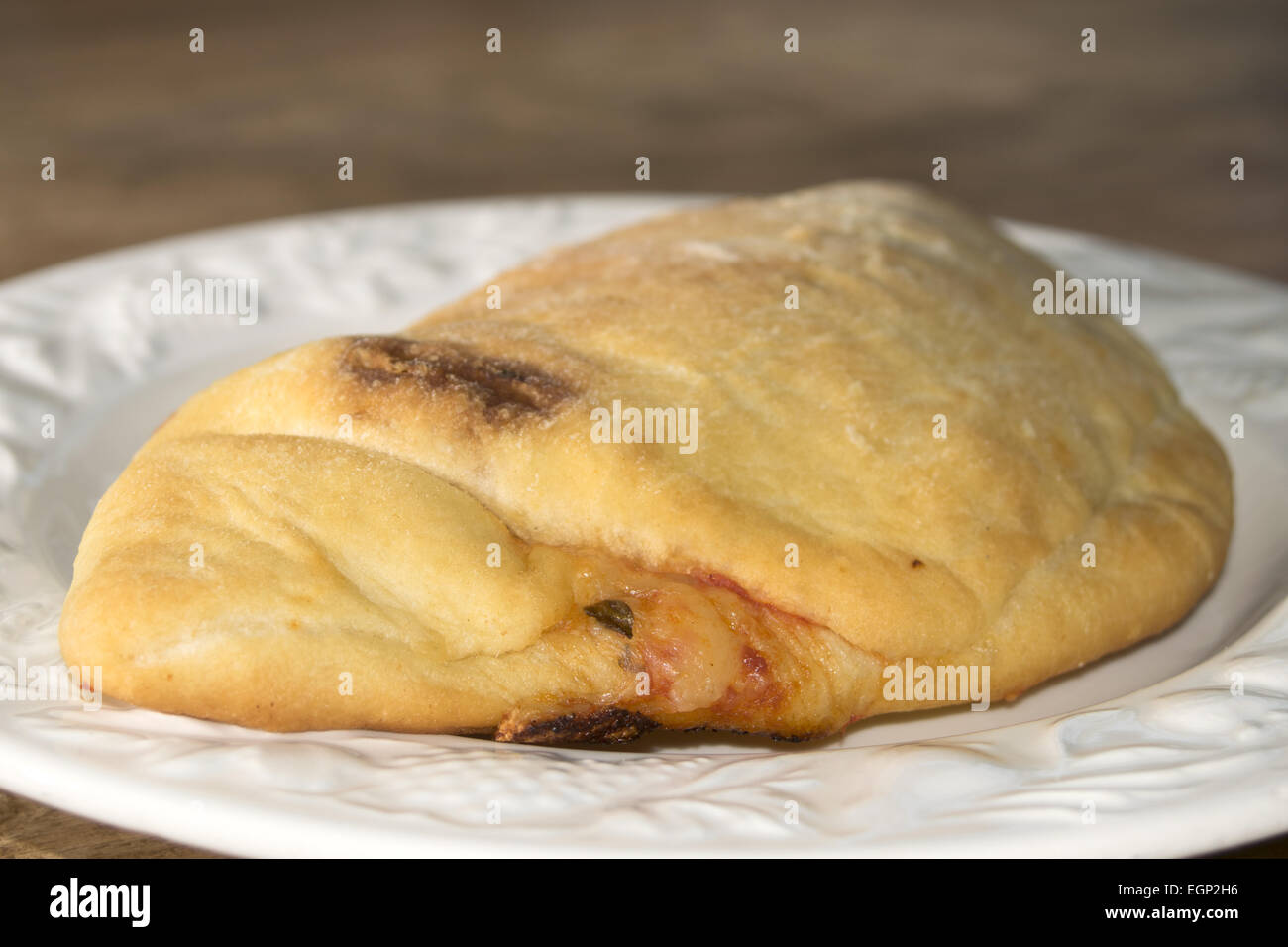 typical neapolitan pizza roll with stuffed of tomato sauce and mozzarella Stock Photo Alamy