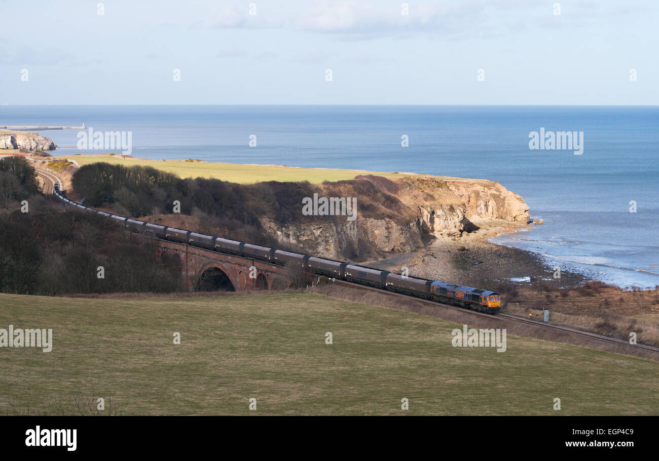 GBRf  diesel powered coal train passing Hawthorn Dene viaduct on the County Durham coast, England, UK Stock Photo