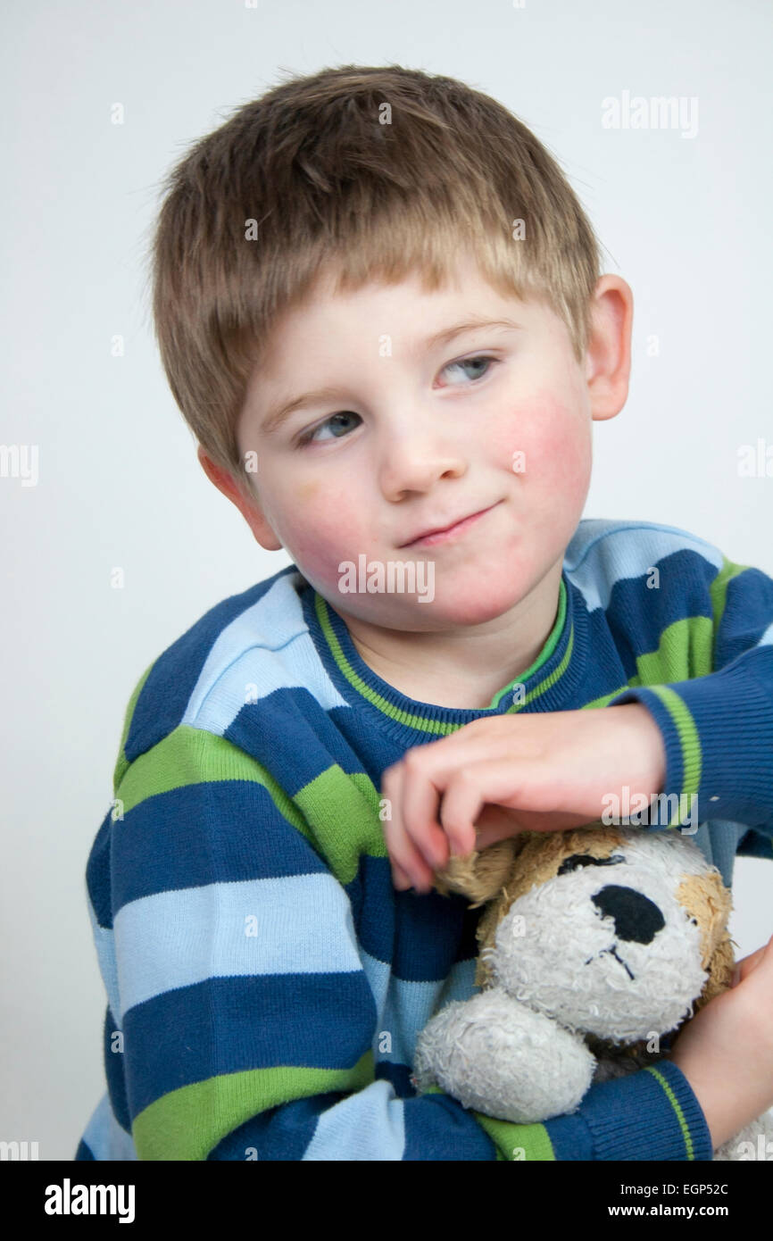 5 year old boy face shots close up curious expression Stock Photo