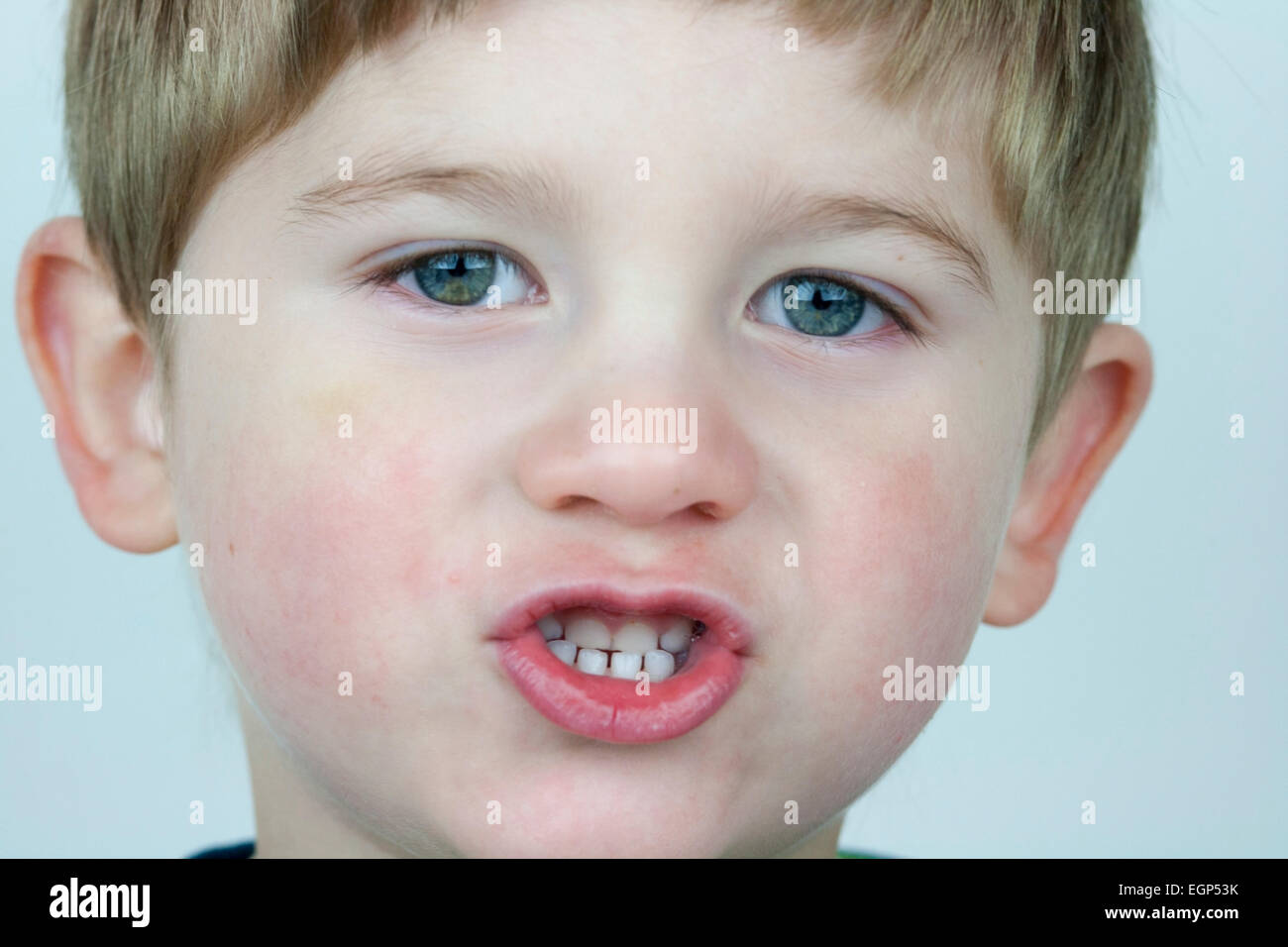 5 year old boy face shots close up talking expression Stock Photo