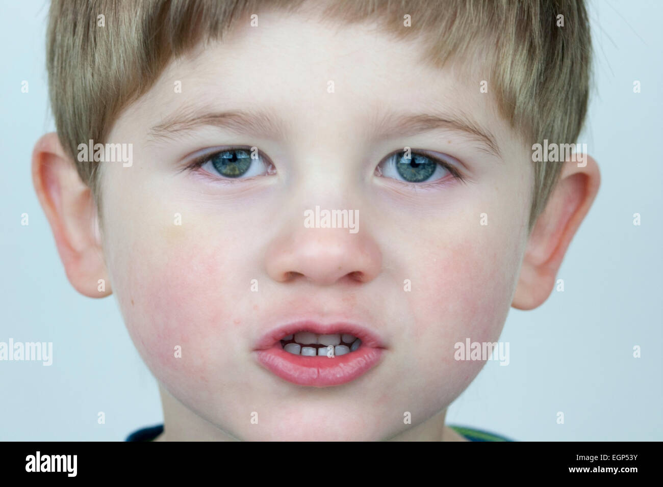 5 year old boy face shots close up talking expression Stock Photo