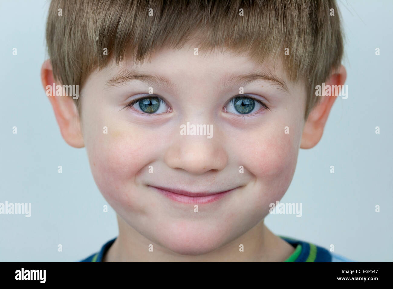 5 year old boy face shots close up questioning expression Stock Photo