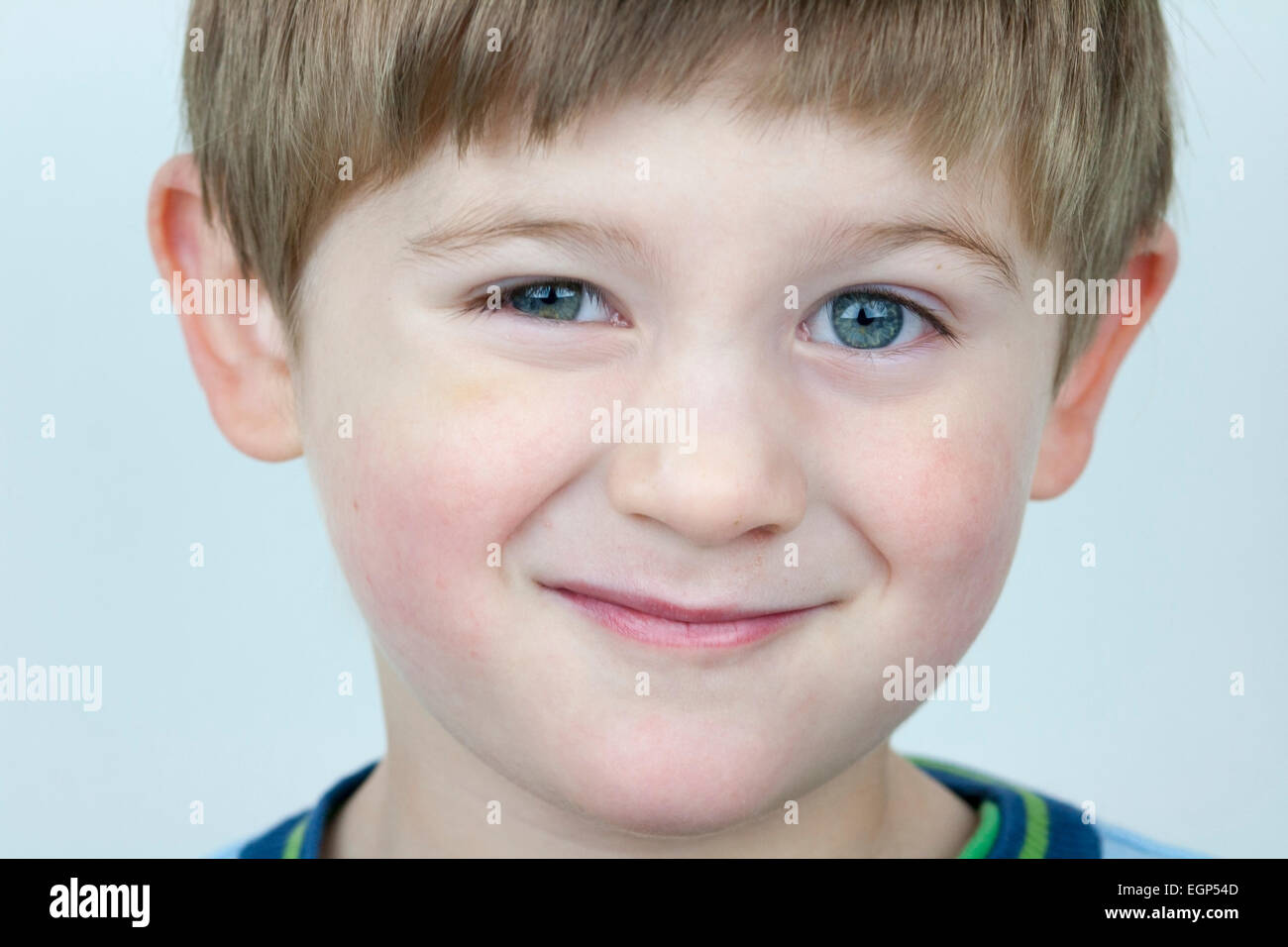 5 year old boy face shots close up unsure expression Stock Photo