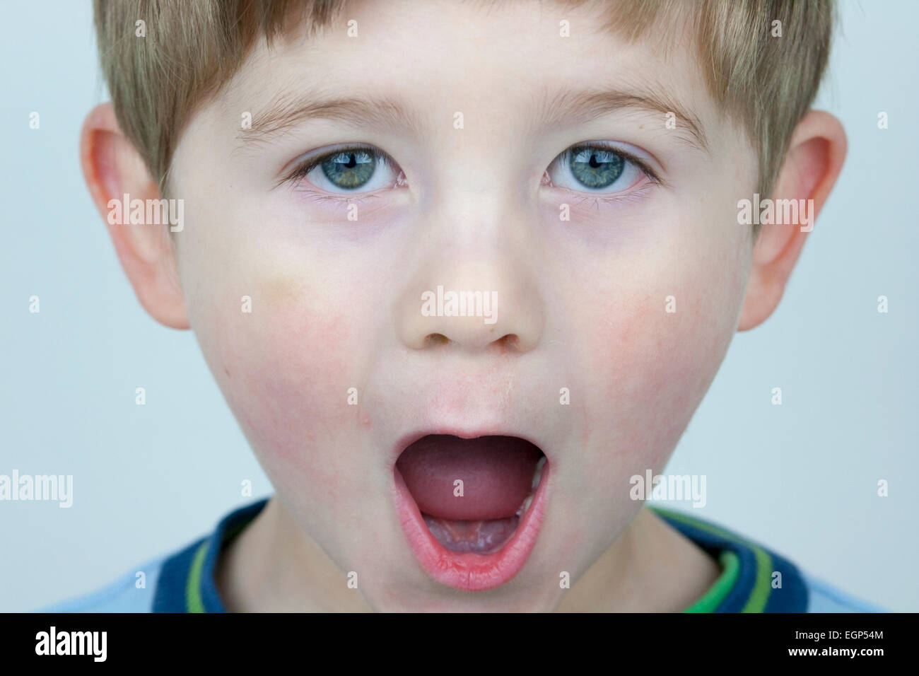 5 year old boy face shots close up Open mouthed expression Stock Photo