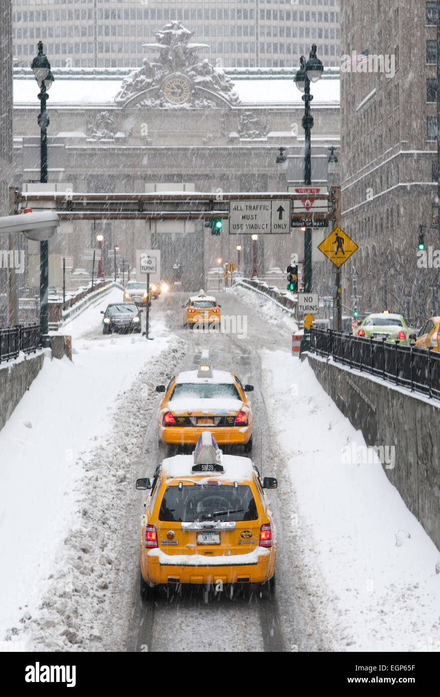 Taxis on Park Avenue in Manhattan heading towards Grand Central Terminal during Winter Storm Pax in 2014. Stock Photo