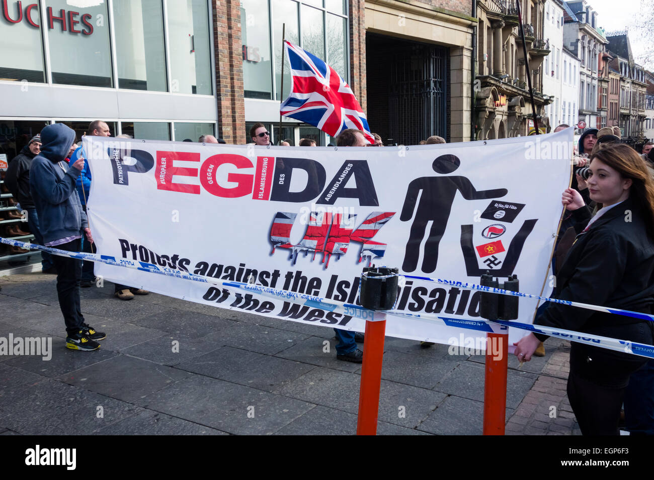 Newcastle upon Tyne, UK. 28th February, 2015. First UK protest by Pegida UK, a group opposed to the 'Islamisation of Europe'. The protest was held in The Bigg Market area of Newcastle city centre, while a counter protest organised by Newcastle Unites was held less than a hundred metres away in Newgate Street Credit:  ALANDAWSONPHOTOGRAPHY/Alamy Live News Stock Photo