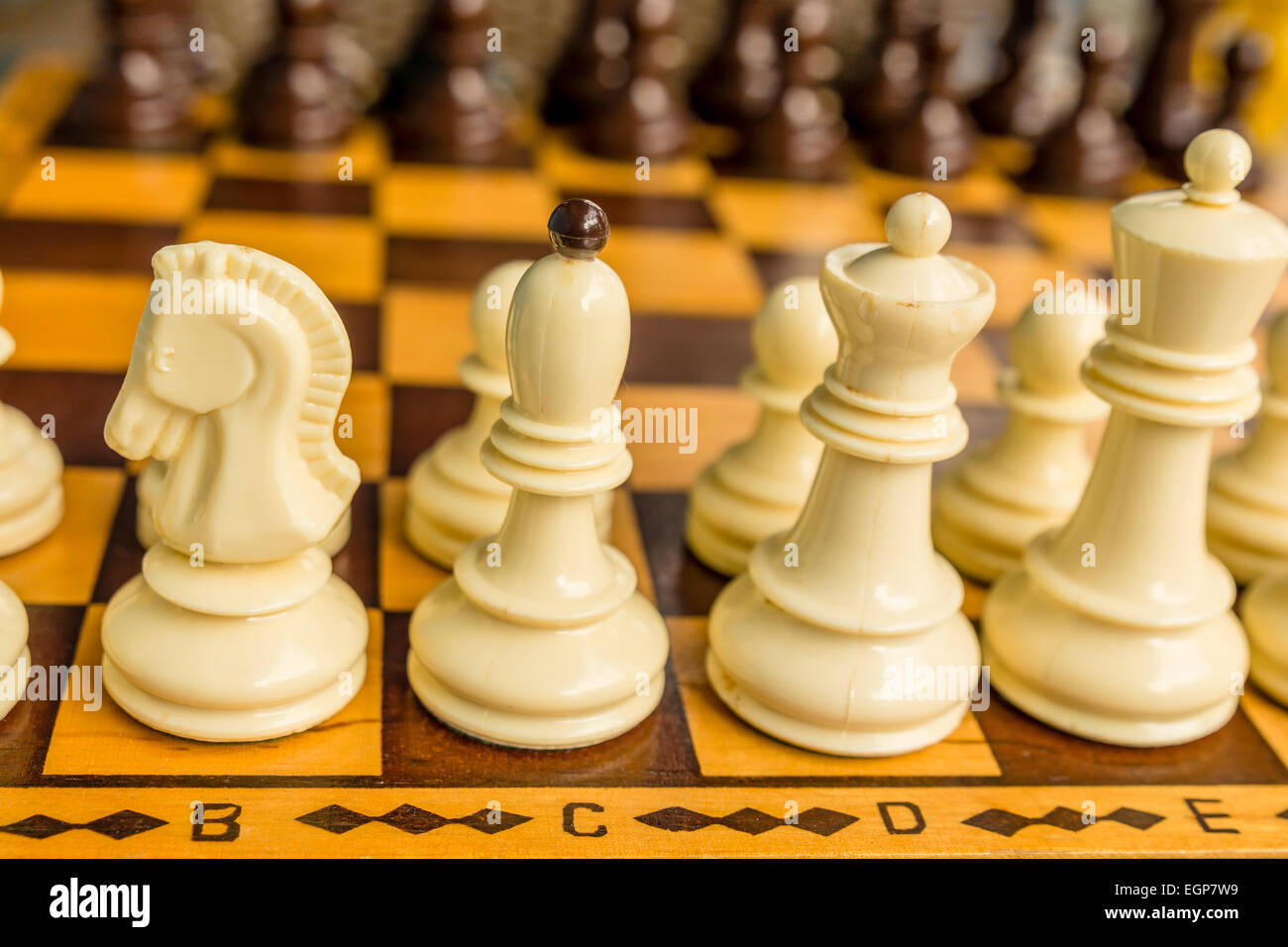 Chess board with starting positions aligned chess pieces Stock Photo