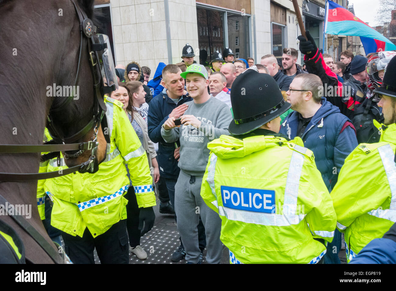 Newcastle upon Tyne, UK. 28th February, 2015. Police prevent Pegida protesters marching towards counter protest in nearby street at first UK protest by Pegida UK, a group opposed to the 'Islamisation of Europe'. The protest was held in The Bigg Market area of Newcastle city centre, while a counter protest organised by Newcastle Unites was held less than a hundred metres away in Newgate Street Credit:  ALANDAWSONPHOTOGRAPHY/Alamy Live News Stock Photo