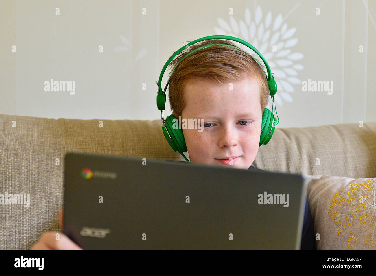 Young girl playing video games on computer after online school Stock Photo  by DC_Studio