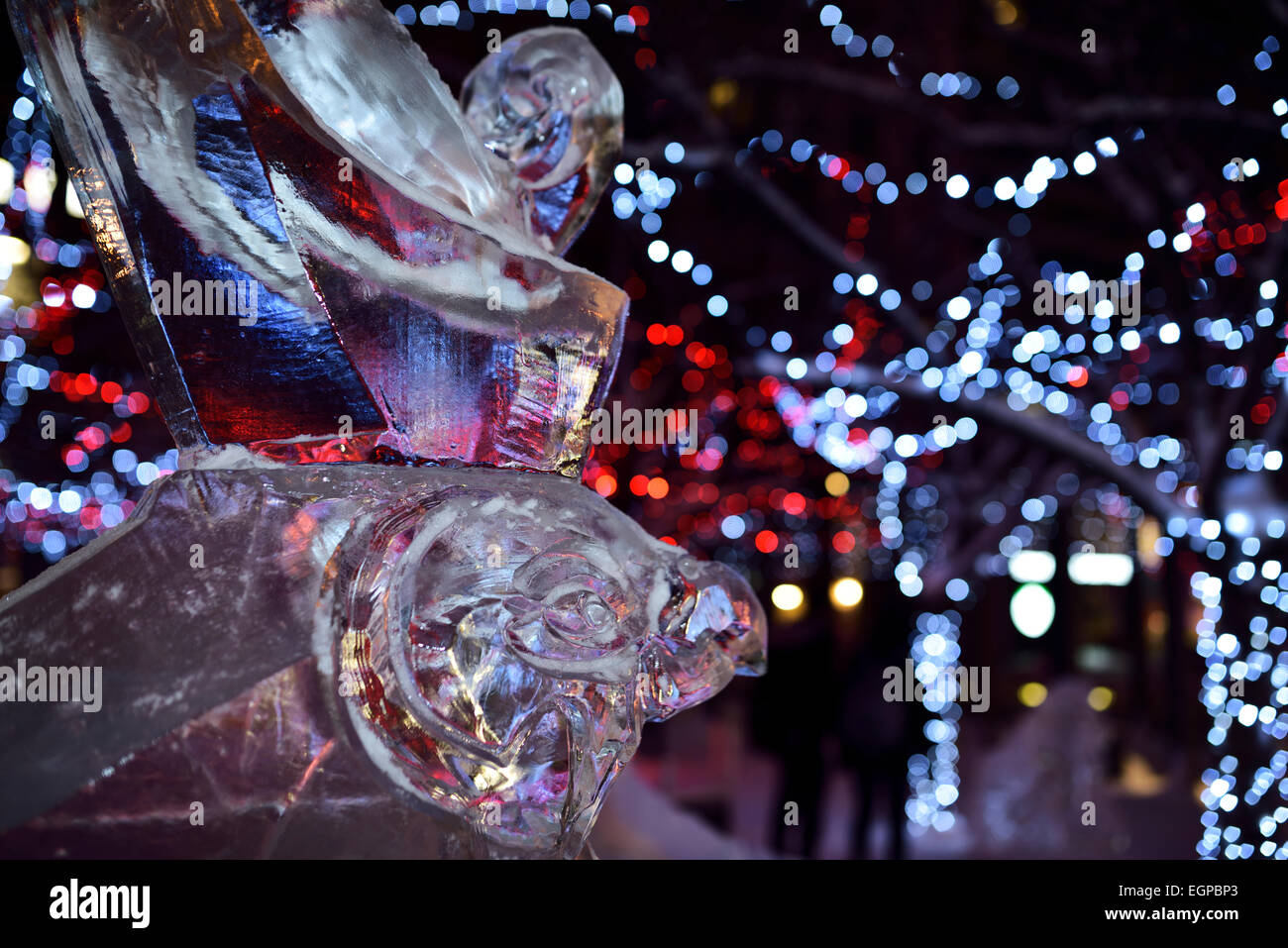 Falcon Horus Egyptian god ice sculpture with purple lights at Yorkville Village Park Annual Icefest Toronto Cumberland street at night Stock Photo