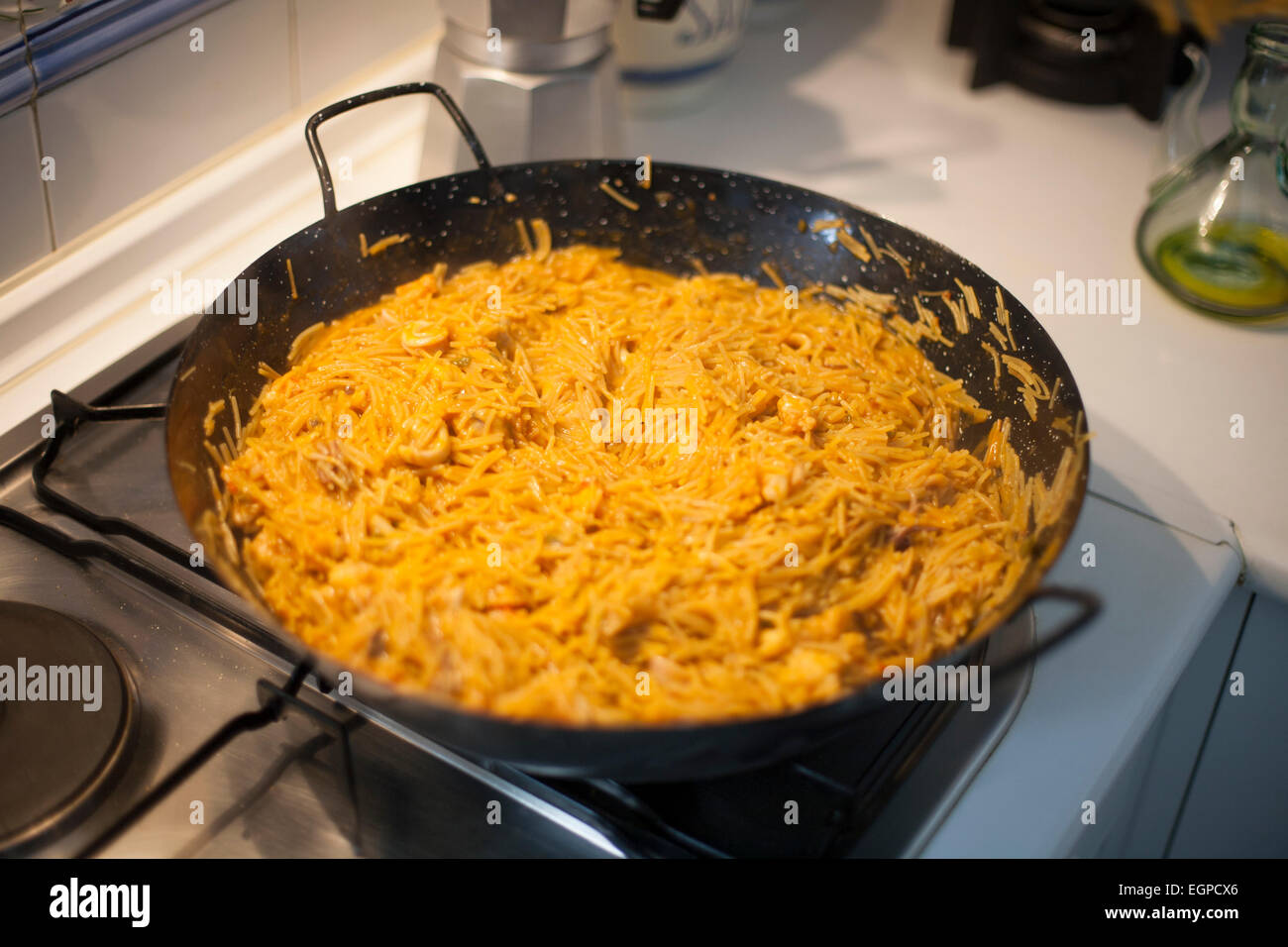 Traditional Spanish fideua. Noodle paella isolated on white background. Top  view Stock Photo - Alamy