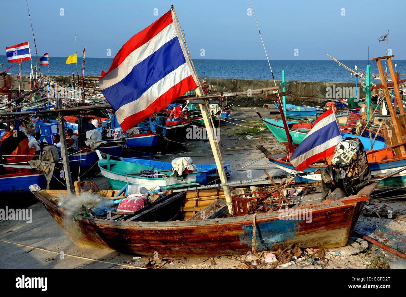 Hua Hin, Thailand Wooden fishing boats flying the Thai flag docked at