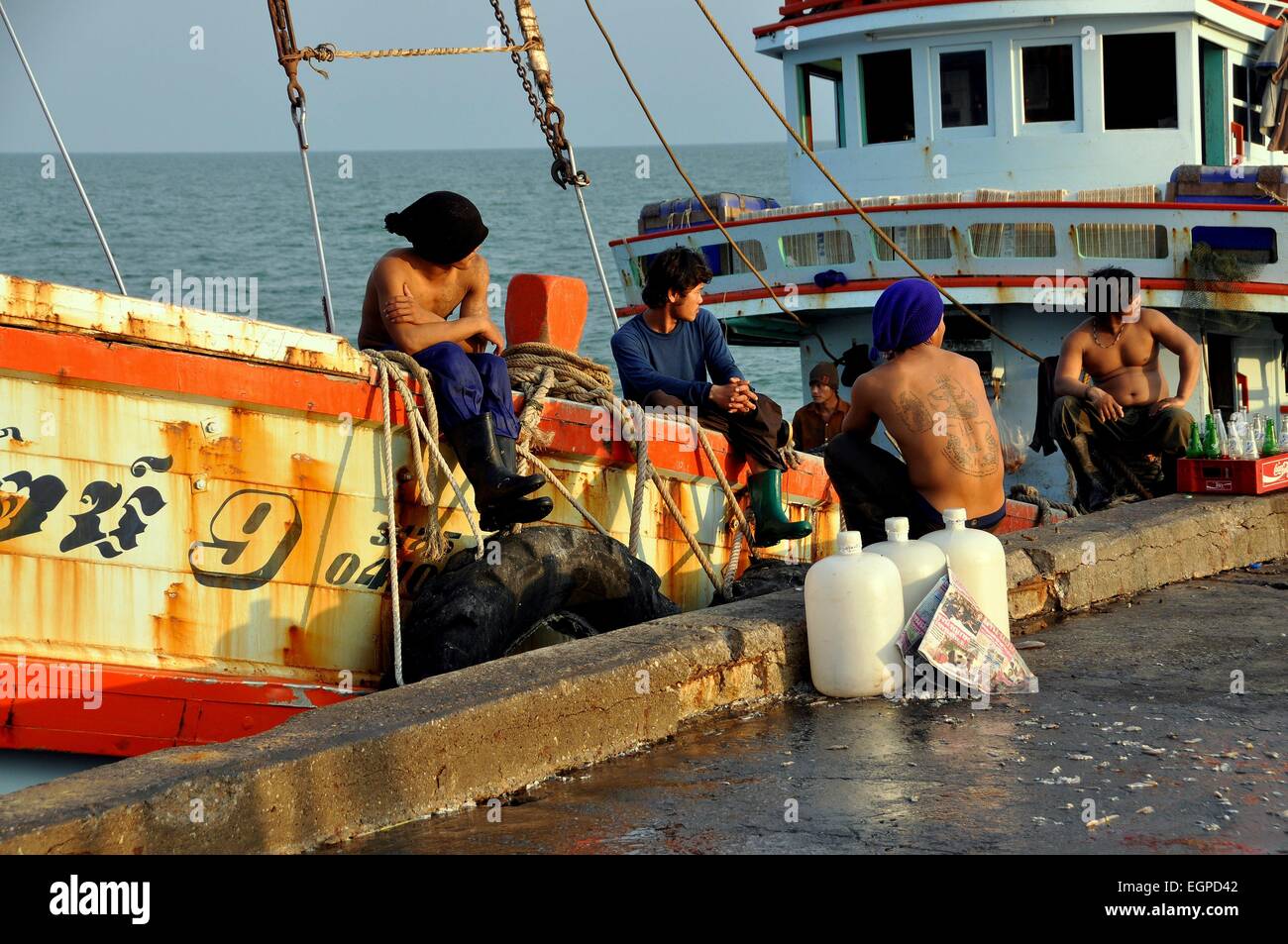 Hua Hin, Thailand Thai fishermen relaxing on their boat docked at the