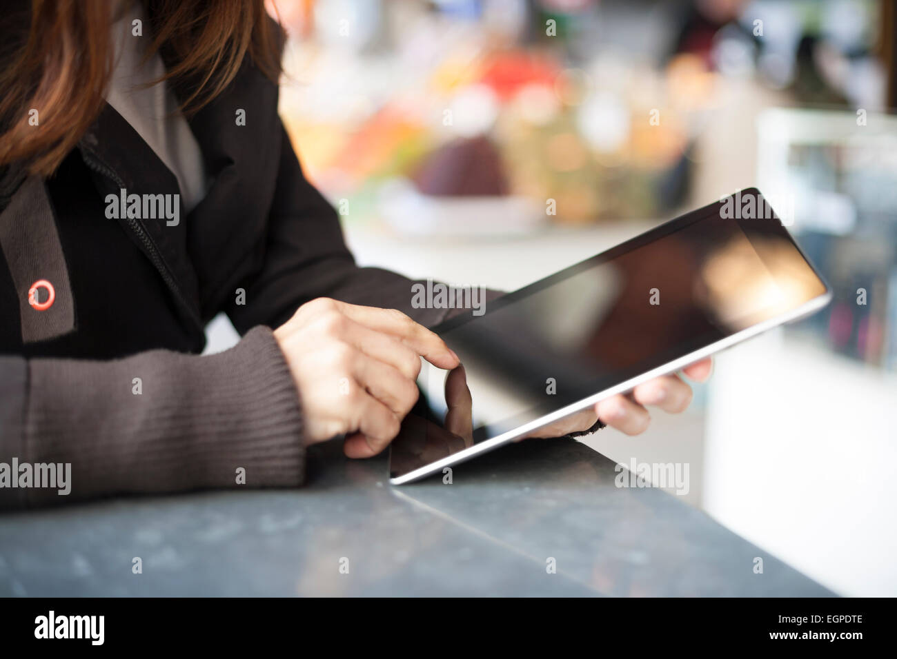 woman hands with digital tablet blank screen in a public market Stock ...