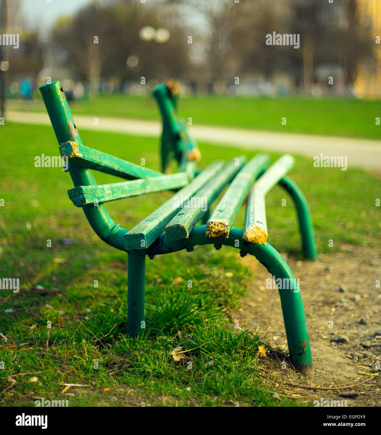 broken green bench in the park Stock Photo Alamy