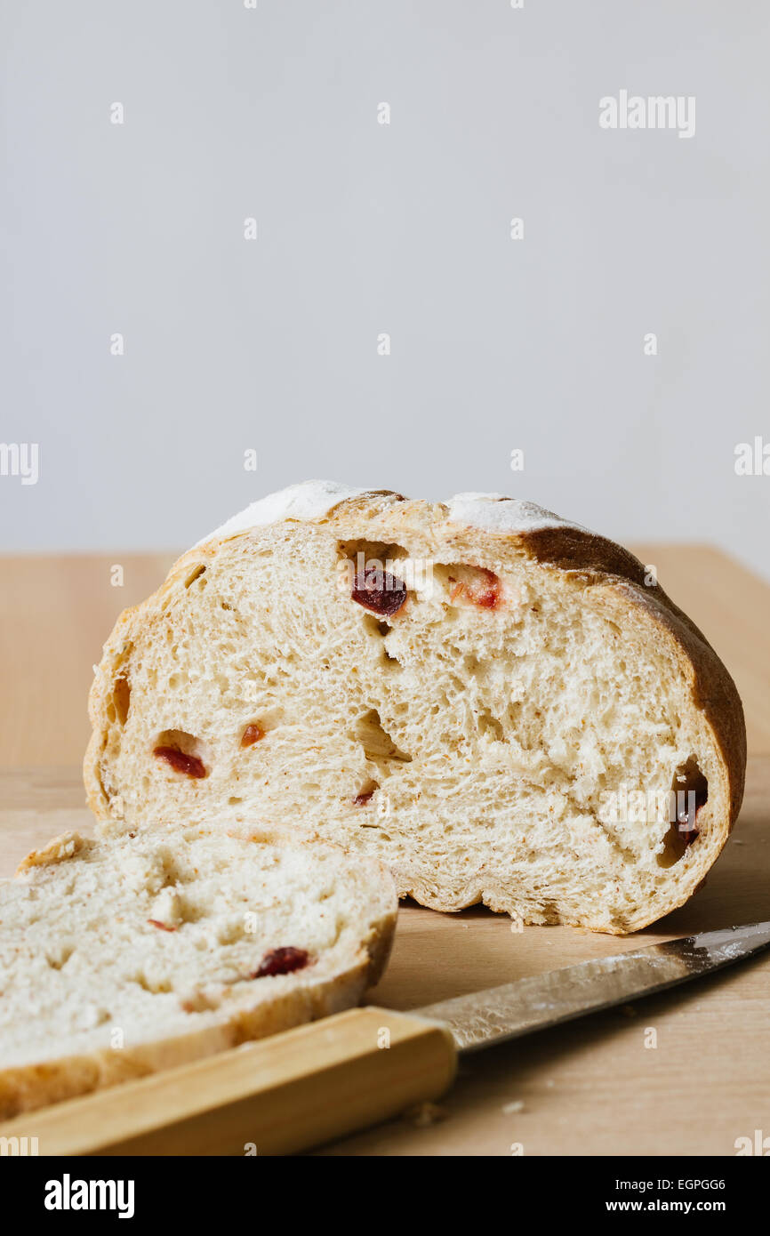 fresh bread on cutting board with knife Stock Photo