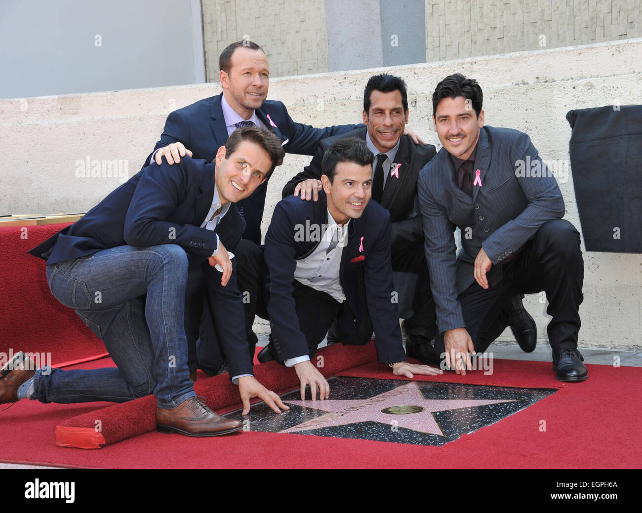 LOS ANGELES, CA - OCTOBER 9, 2014: Pop group New Kids On The Block - Jordan Knight, Jonathan Knight, Donnie Wahlberg, Joey McIntyre & Danny Wood - on Hollywood Boulevard where they were honored with the 2,530th star on the Hollywood Walk of Fame. Stock Photo