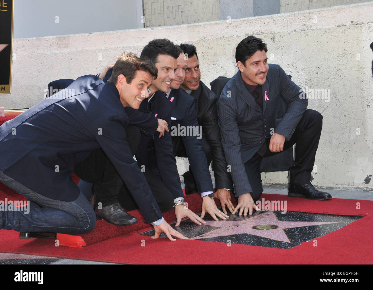 LOS ANGELES, CA - OCTOBER 9, 2014: Pop group New Kids On The Block - Jordan Knight, Jonathan Knight, Donnie Wahlberg, Joey McIntyre & Danny Wood - on Hollywood Boulevard where they were honored with the 2,530th star on the Hollywood Walk of Fame. Stock Photo
