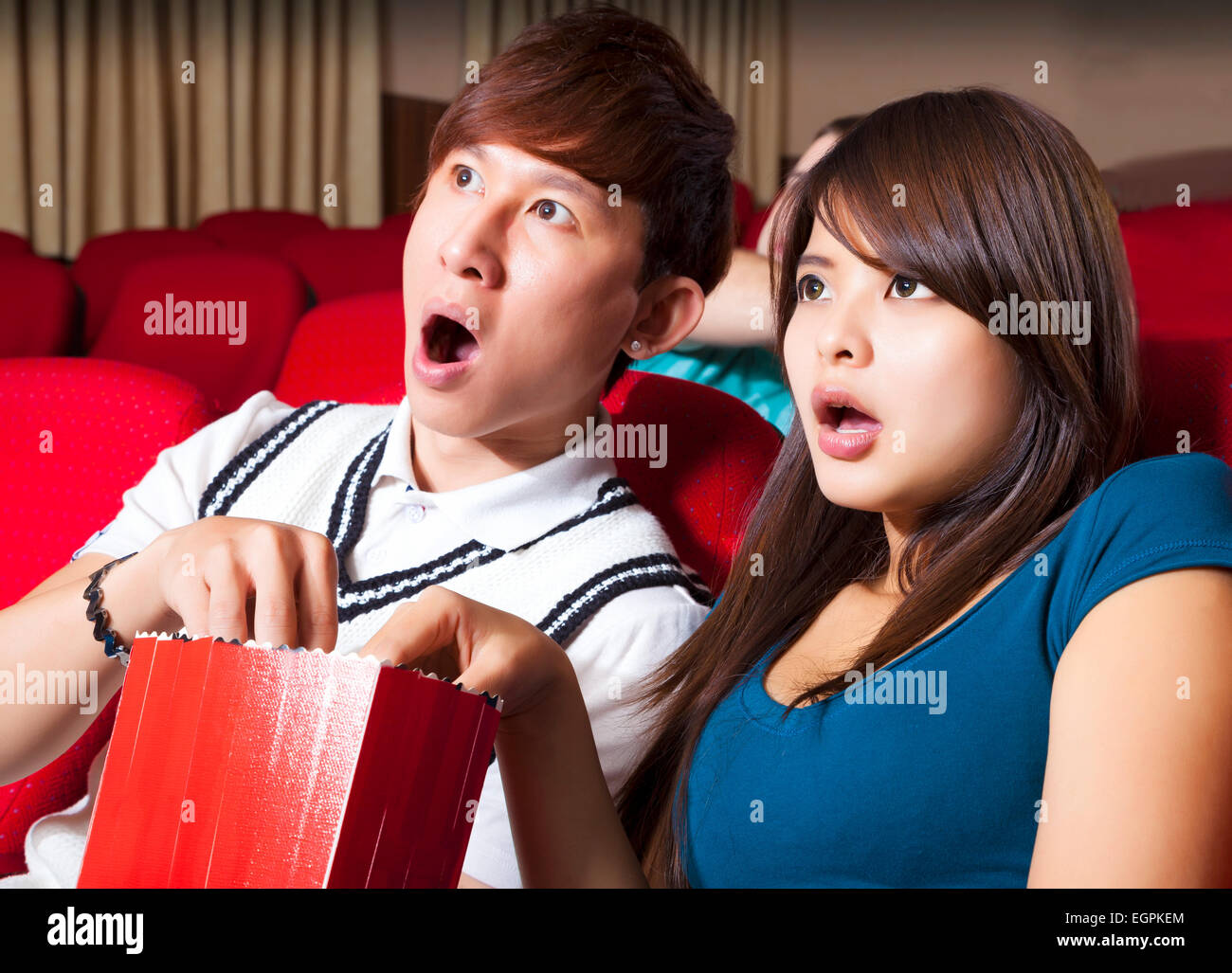 Young couple  watching a movie at the cinema Stock Photo