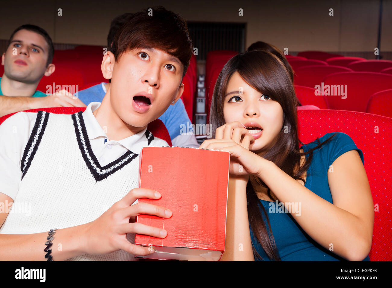 Young couple  watching a movie at the cinema Stock Photo