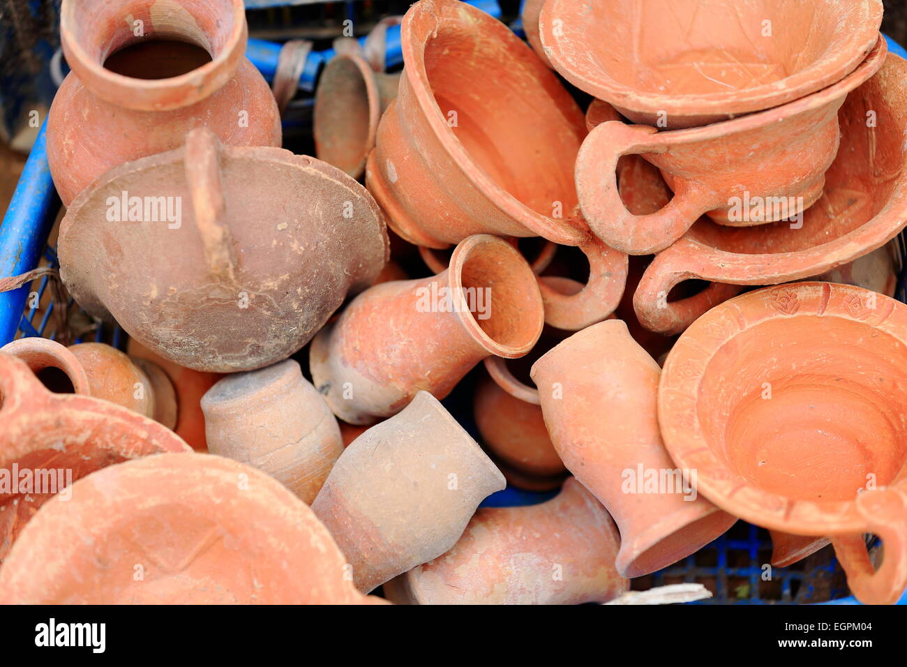 Clay pottery for salehousehold items cupsbowlsjarsvases in a shop