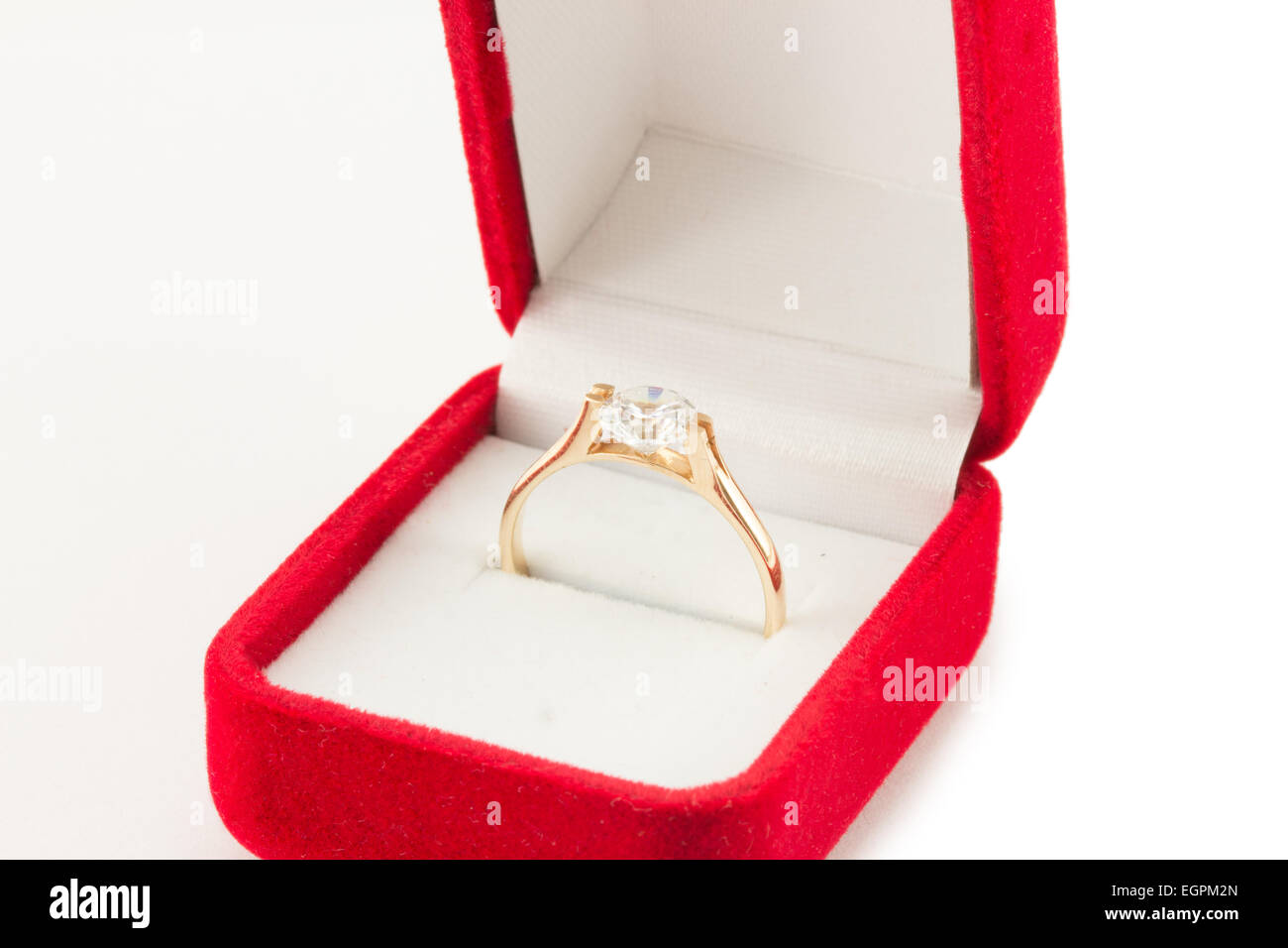 gold wedding ring in a red gift box Stock Photo - Alamy