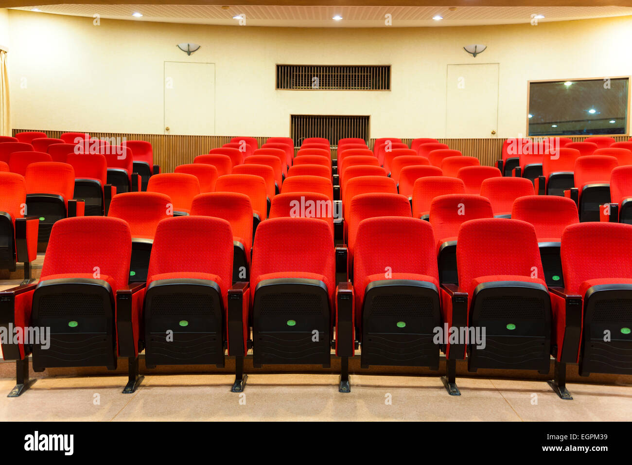 Interior of empty conference hall with red chairs Stock Photo