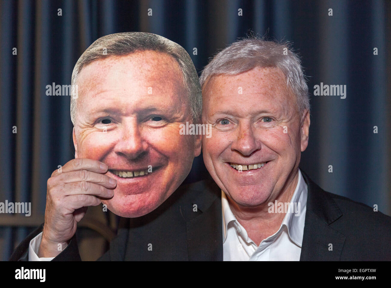 Walsall, West Midlands, UK. 28th February, 2015. Big Centre TV: Presenter broadcaster David Hamilton with mask of himself at the launch of the new Midlands television station. Big Centre TV is the new local television station for the Midlands – Birmingham, Walsall, Wolverhampton, Solihull and The Black Country. The channel went on air on Freeview channel 8 at 6pm on Saturday 28 February 2015. The station serves a potential audience of 2.3 million around Birmingham and the Black Country. Credit:  John Henshall/Alamy Live News PER0453 Stock Photo