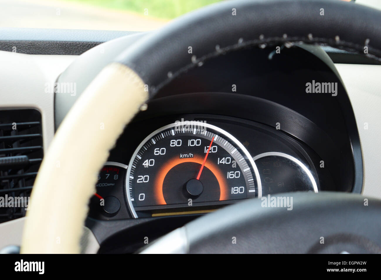 Speed on speedometer 120 km/hr speeding car at National Highway Kerala India Stock Photo
