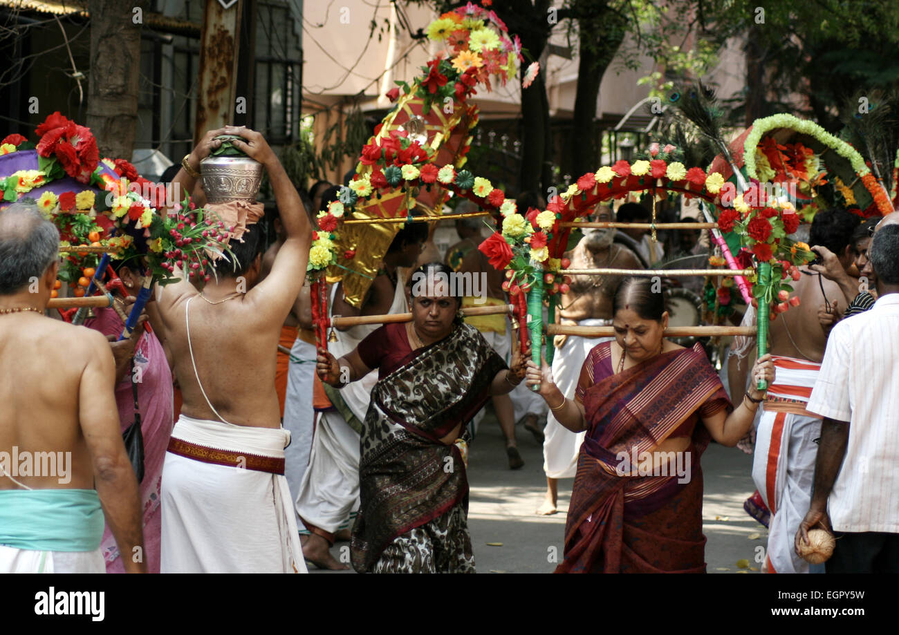 Hindu devotees take procession of lord Subramanya swamy in the streets with murugan kavadi in Hyderabad,India on April 13,2014. Stock Photo