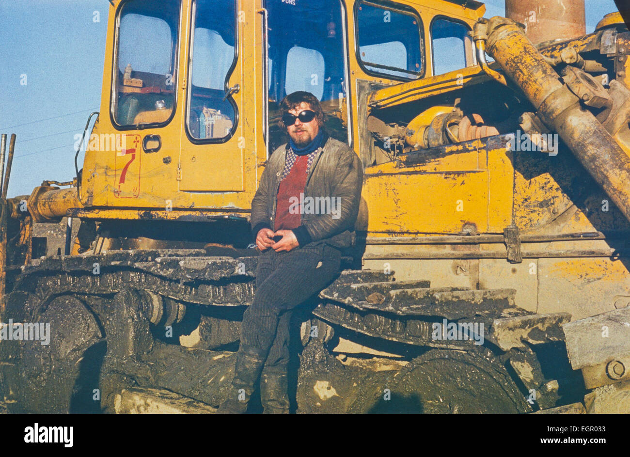 Chukchi Peninsula, USSR - August 01, 1980:Portrait of young soviet tractor driver having a short rest in hard gold mining work Stock Photo