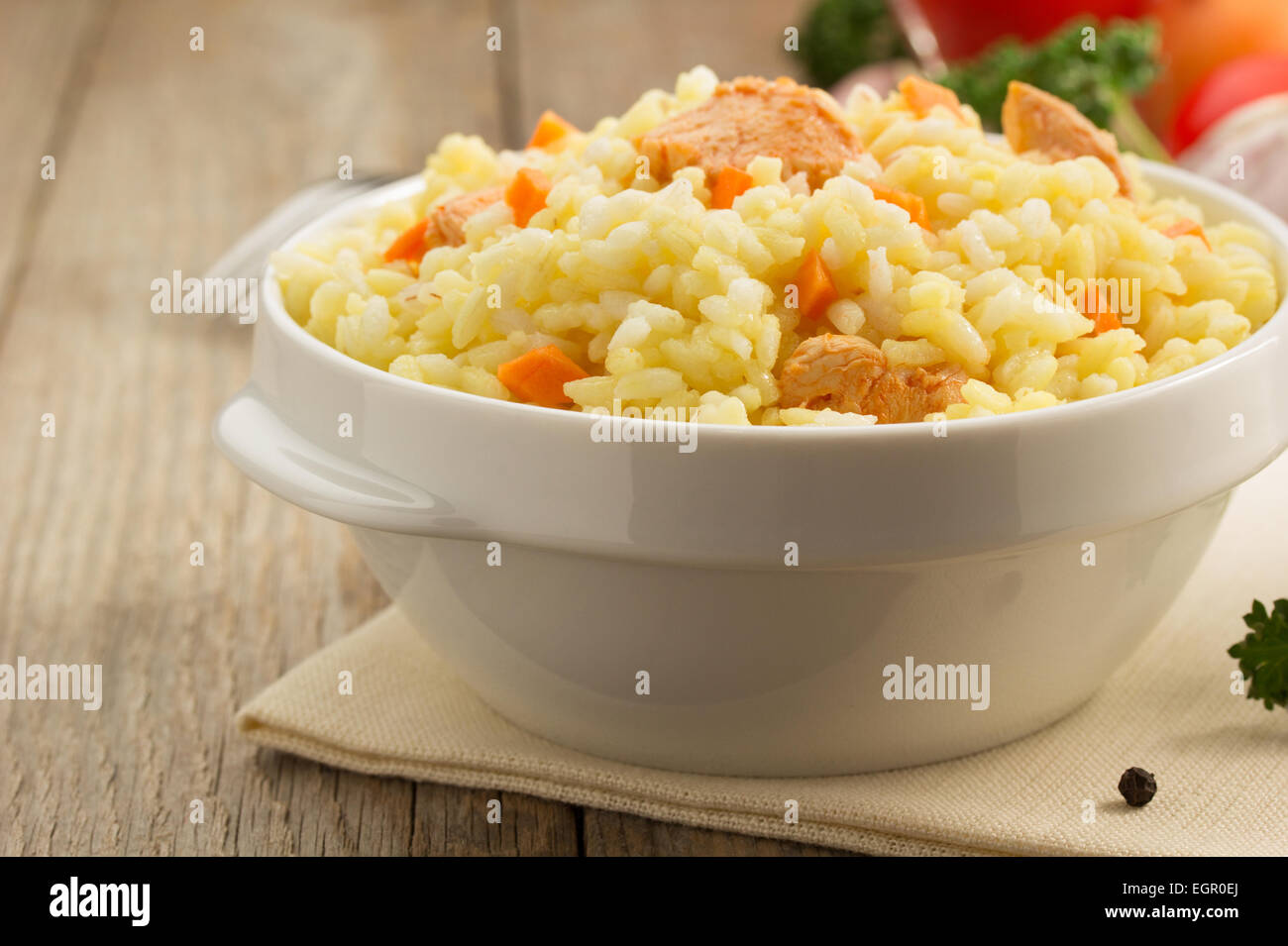 bowl full of rice on wooden background Stock Photo - Alamy