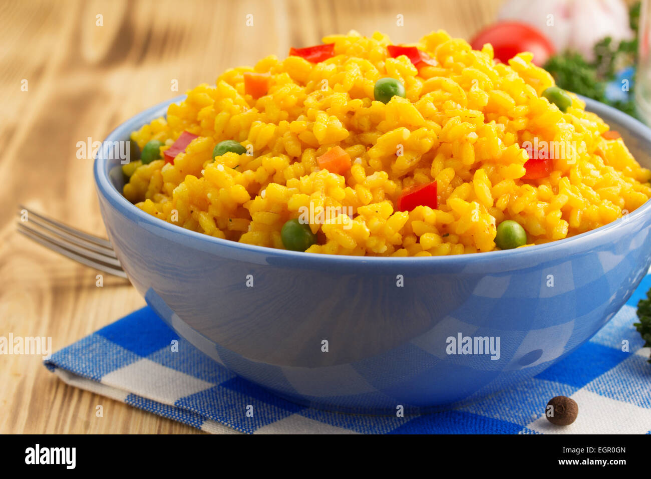 bowl full of rice on wooden background Stock Photo - Alamy