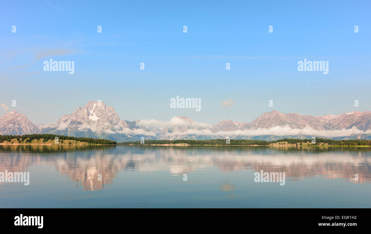 Jenny Lake with the Grand Tetons in the background on a fine morning in summer near Jackson, Wyoming, USA. Stock Photo