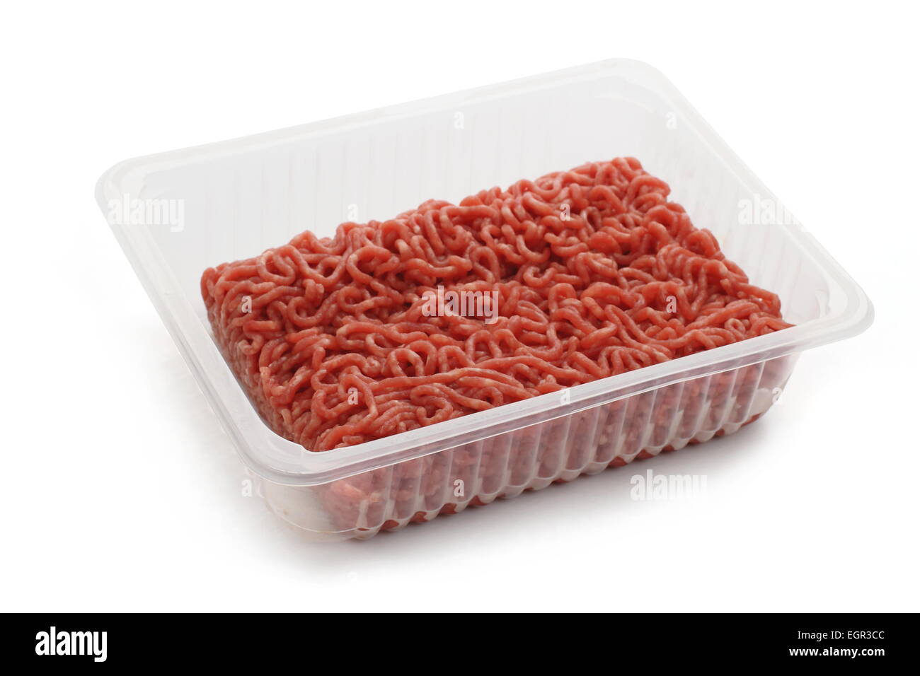 heap beef minced meat in plastic cup, isolated Stock Photo