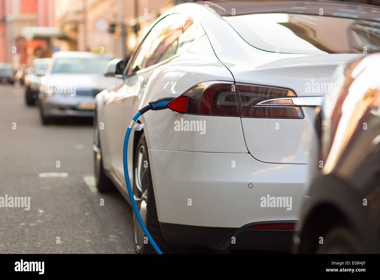 Electric Car in Charging Station. Stock Photo