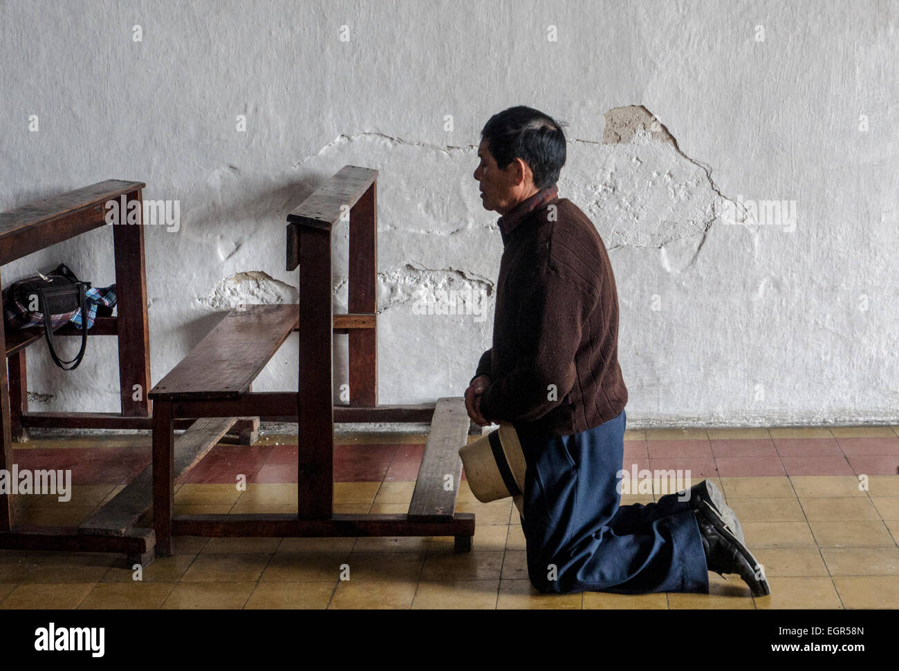 Man prays on his knees hi-res stock photography and images - Alamy