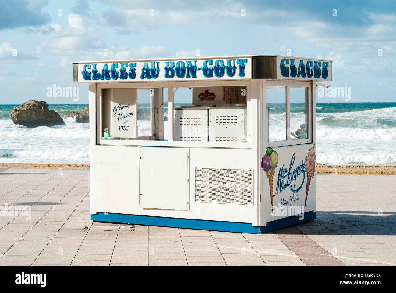 Ice cream kiosk on the Promenade in Biarritz, a holiday destination on the Atlantic coast of France, with Bay of Biscay view Stock Photo