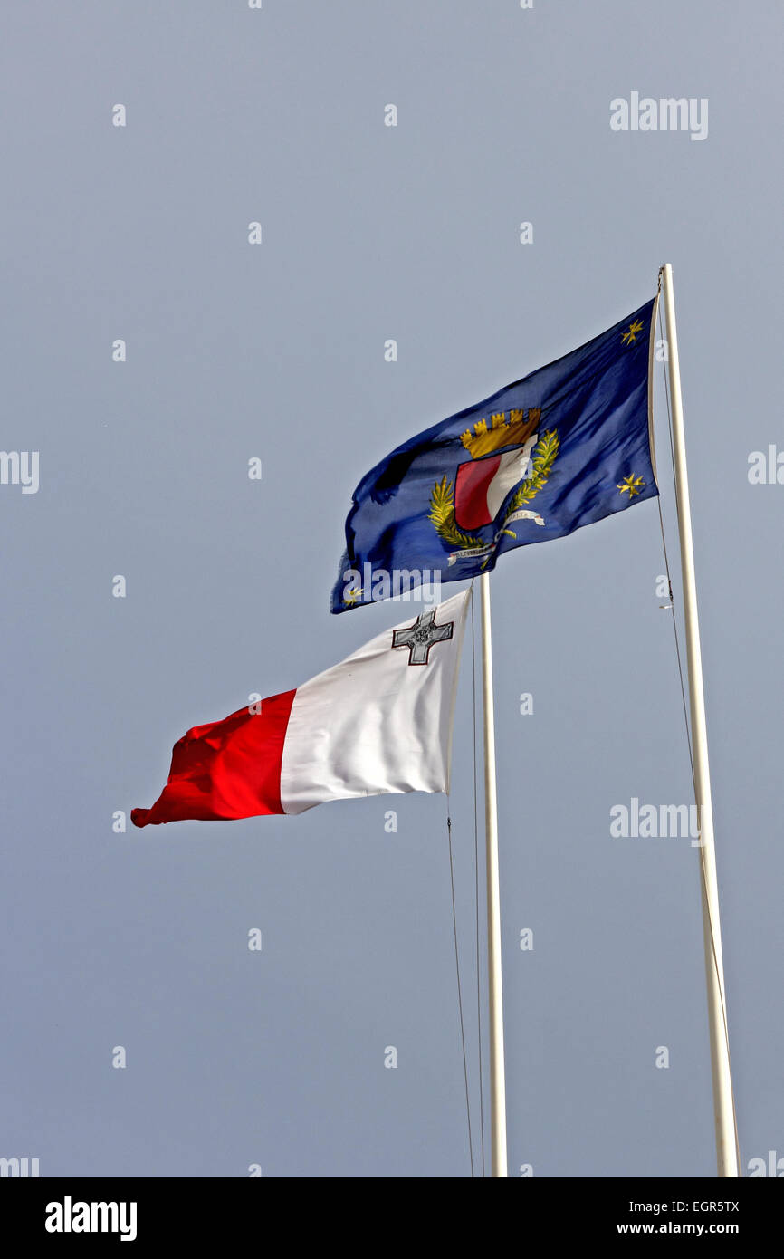 Maltese national and President's flags being flown in Valletta, Malta Stock Photo