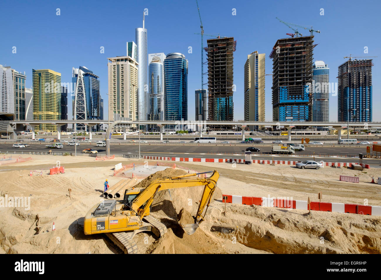 Skyline of Jumeirah Lakes Towers (JLT) and Sheikh Zayed Road with construction site in Dubai United Arab Emirates Stock Photo