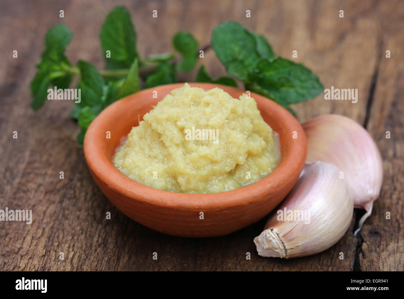 Fresh crushed ginger with garlic and mint leaves Stock Photo